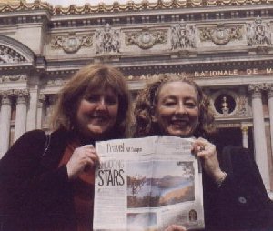 Holding the Northwest Travel section of The Oregonian in front of the Opera